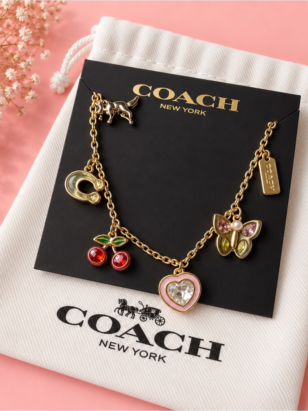 Coach Gold-Tone Charm bracelet with Pink Heart, Red Cherry & Green Butterfly